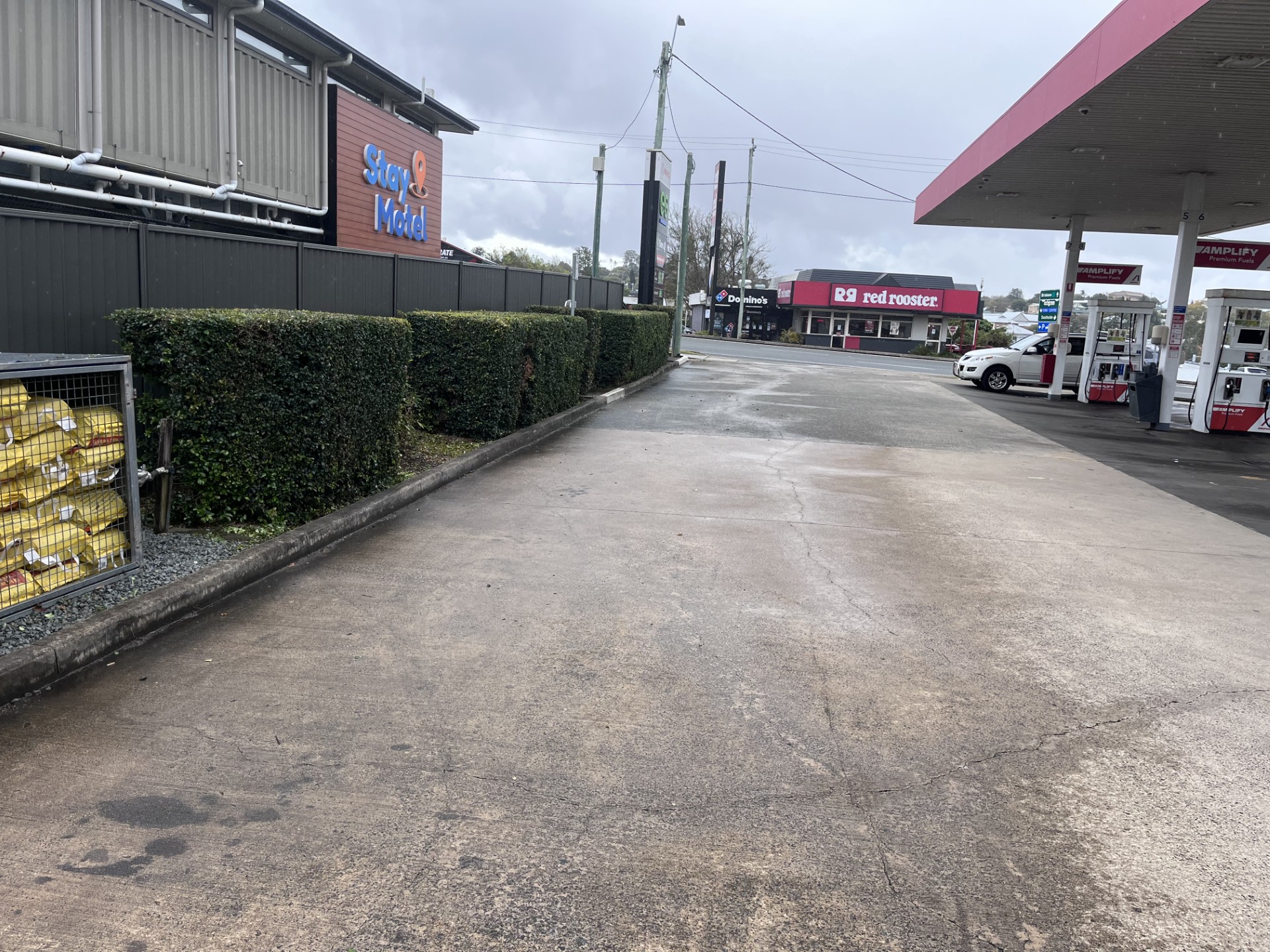 Commercial Premises Maintenance: Service station hedge trim — after