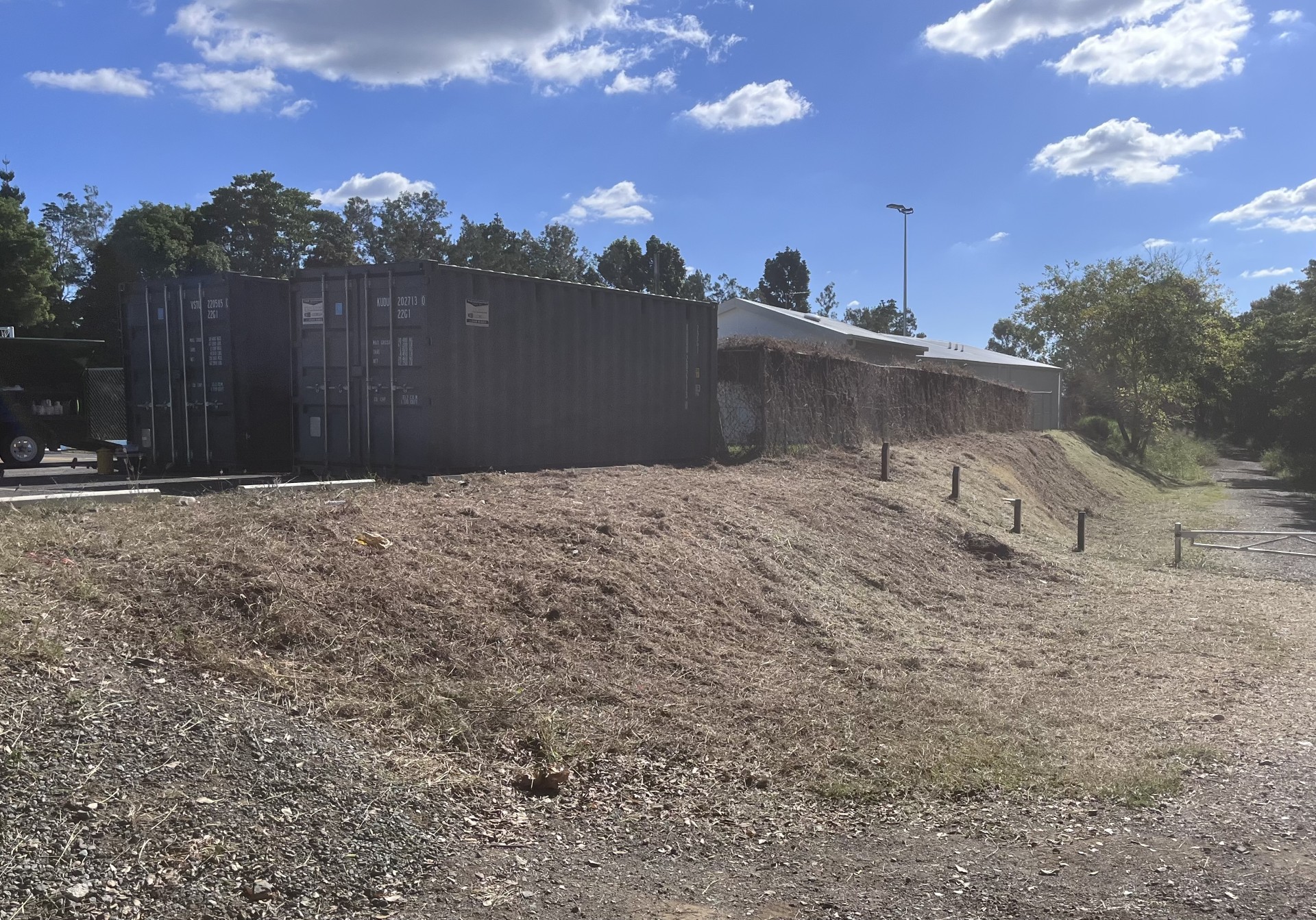 Acreage Property Maintenance: Brush cutting overgrown steep batter — after
